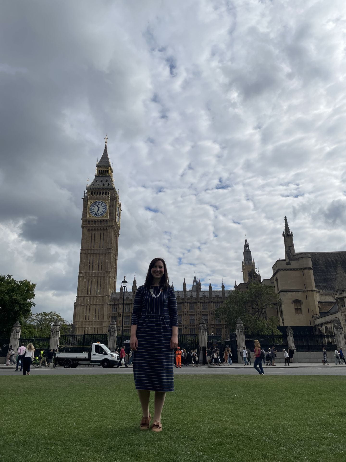 Professor Hanya Pielichaty standing outside of parliament with Big Ben in the background